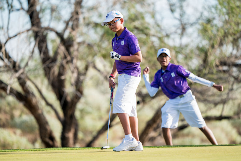 SCOTTSDALE, AZ - NOVEMBER 17:  Seth Neou (8) and teammate Elijah Selby (3) of Team Virginia celebrate a birdie putt at the seventh hole during the second session of the 2018 PGA Jr. League Championship presented by National Car Rental held at Grayhawk Golf Club in Scottsdale, Arizona on November 17, 2018. (Photo by Darren Carroll/PGA of America)